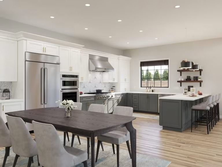 Modern open kitchen and dining area with dark island, stainless appliances, white cabinets, and wood floors