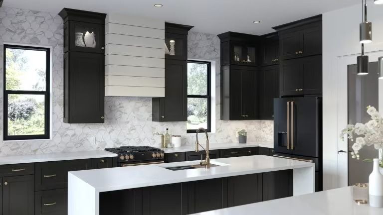 Modern kitchen with black cabinets, white island, stainless appliances, and large windows.
