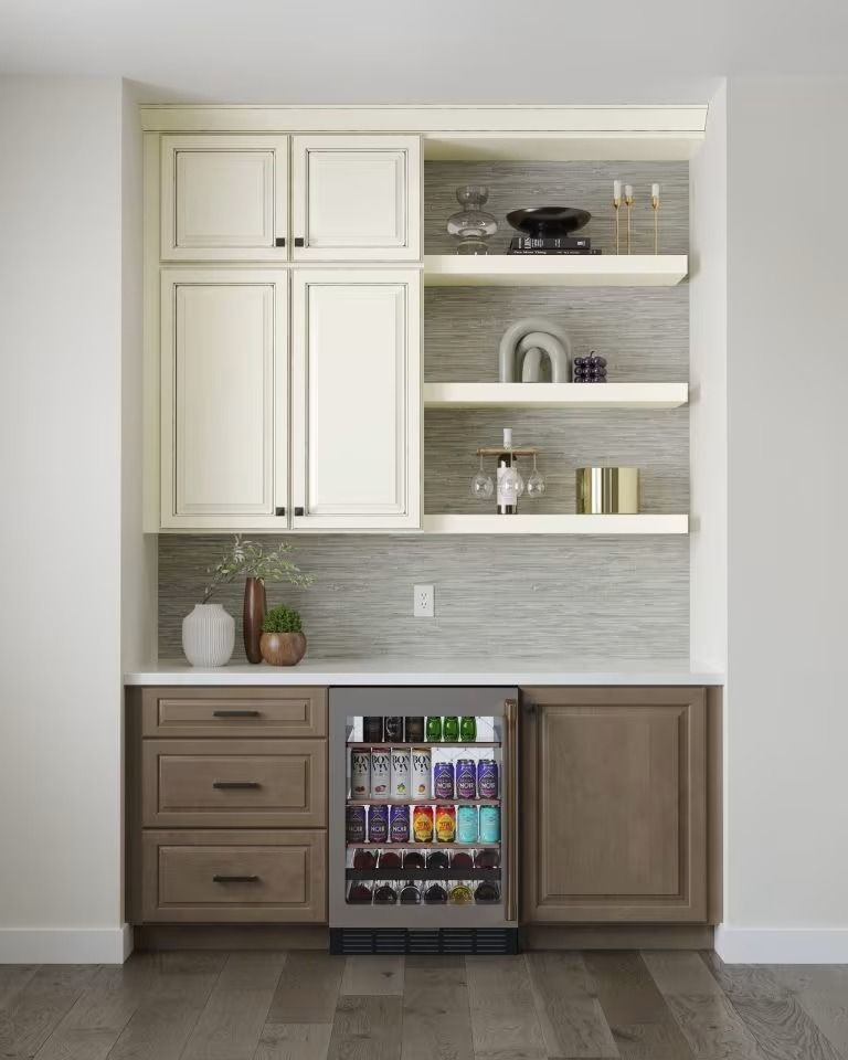 Built-in kitchen bar with white cabinets, wood lower cabinets, open shelves, and a small beverage fridge