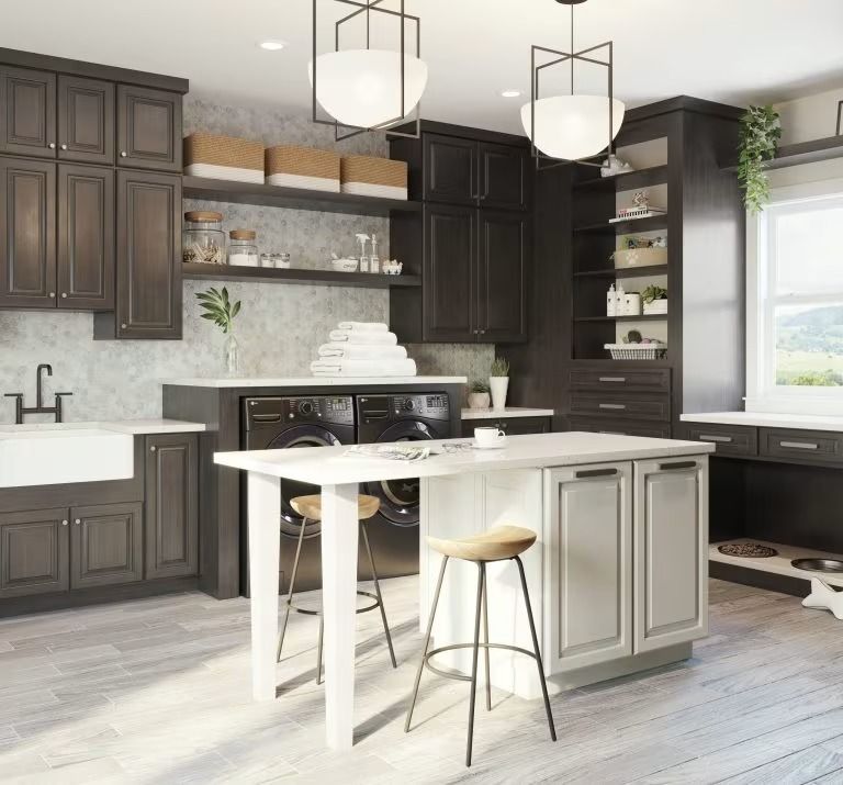 Modern dark gray kitchen with white island, pendant lights, open shelving, and large window