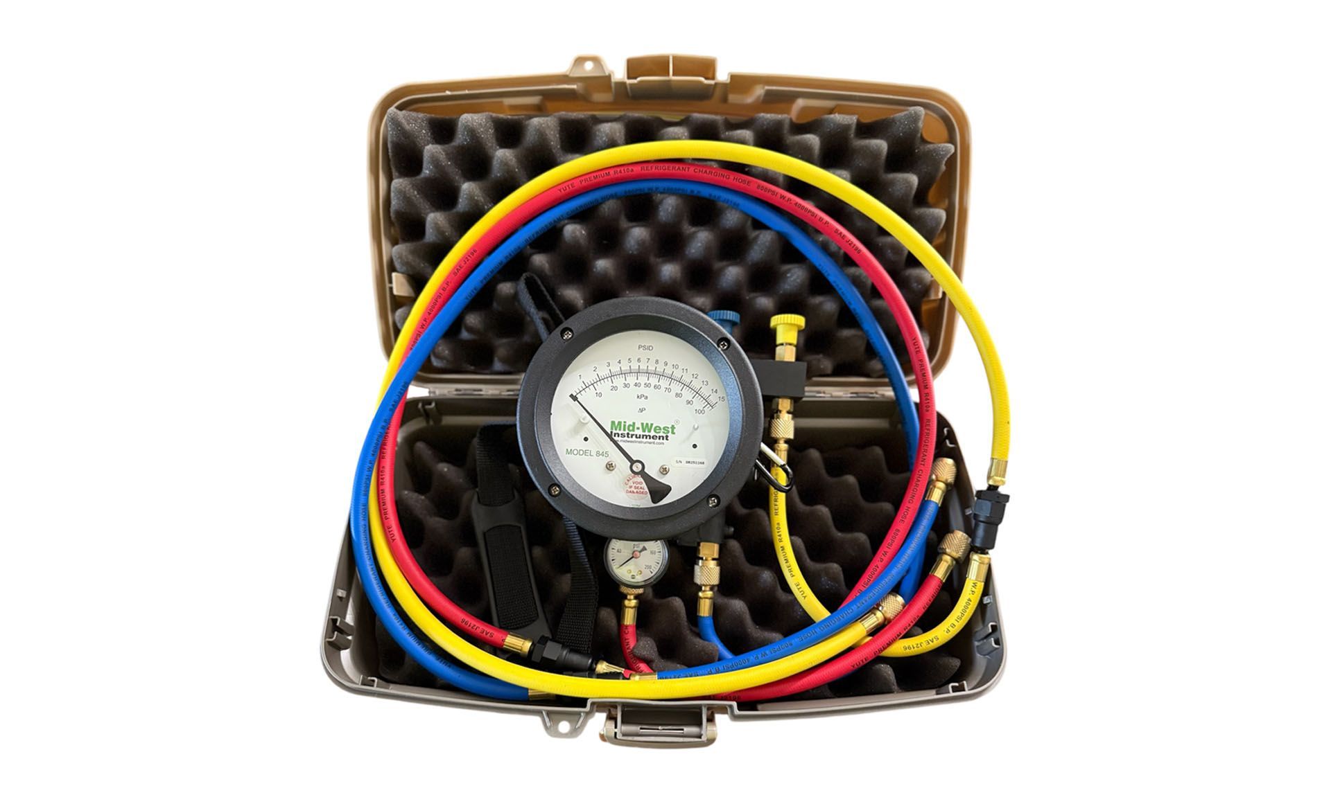 A set of gauges in a case, with blue, red, and yellow hoses.