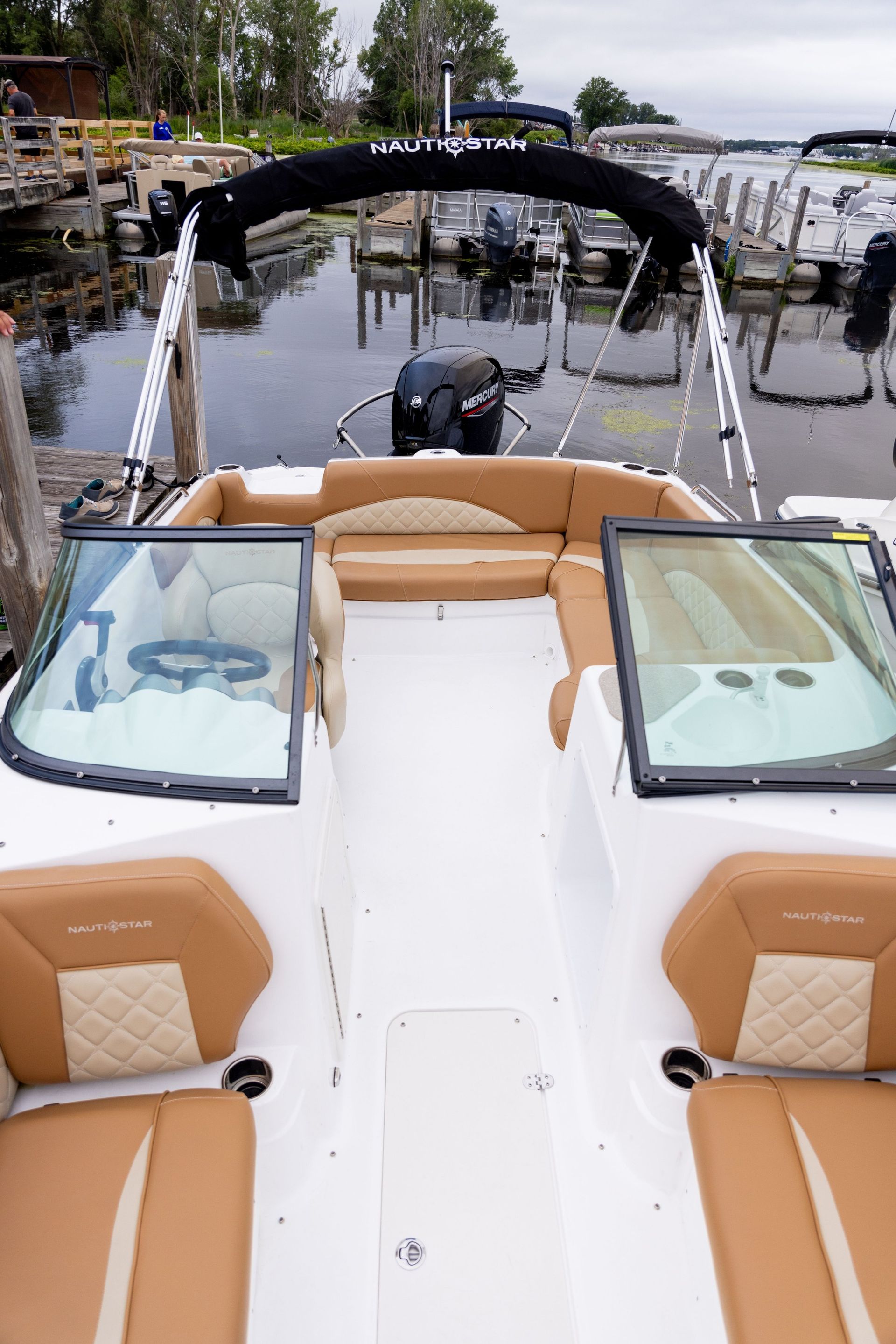 The back of a boat is sitting in the water.