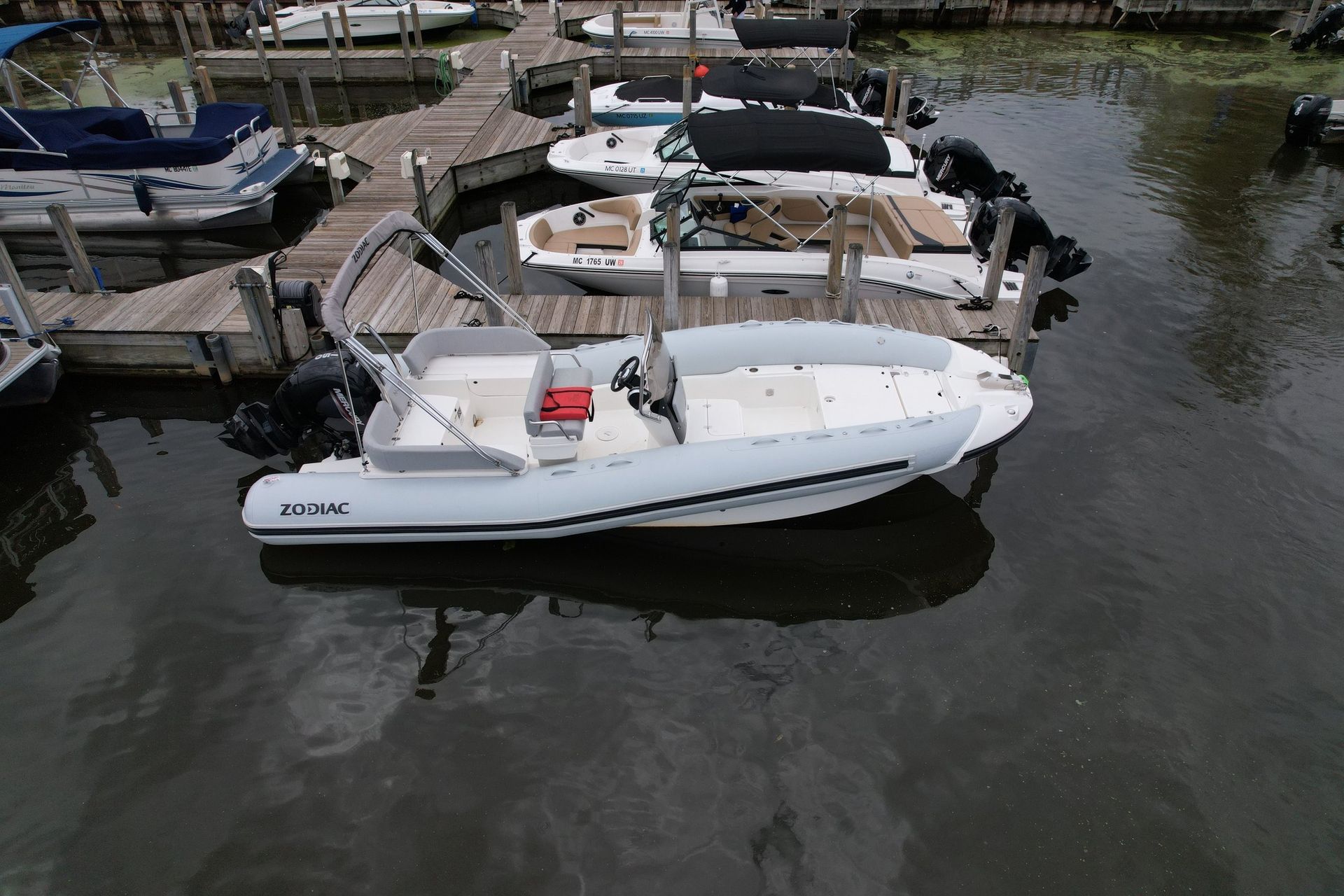 A boat is docked at a dock in the water.
