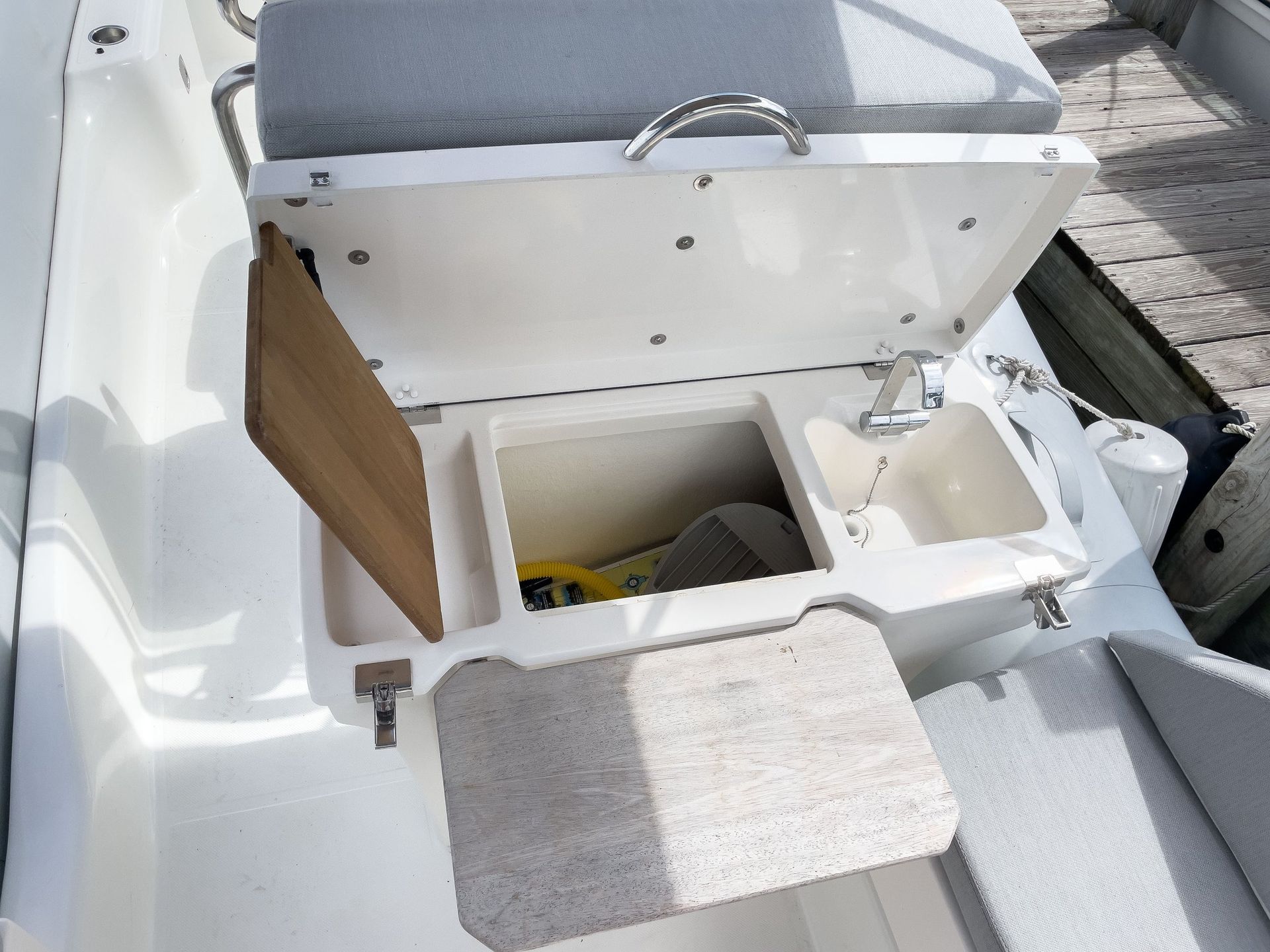 The back of a boat with the cooler open