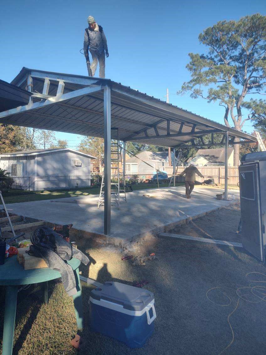 A man is standing on top of a metal roof.