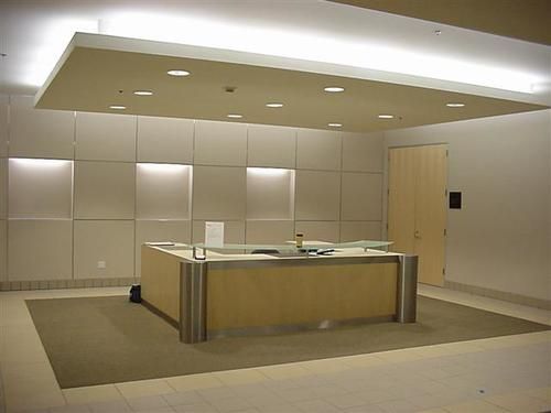 A large room with a wooden counter in the middle