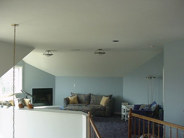 A living room with a couch and a fireplace