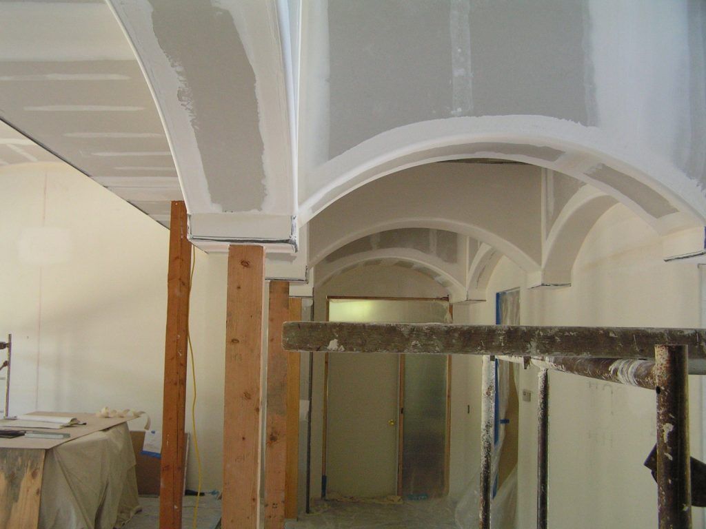 A hallway with a ceiling that is being built