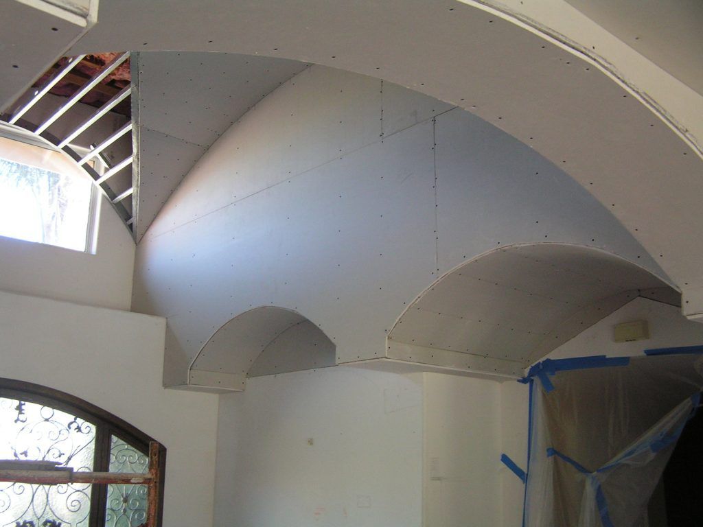 A room with a dome shaped ceiling and a window
