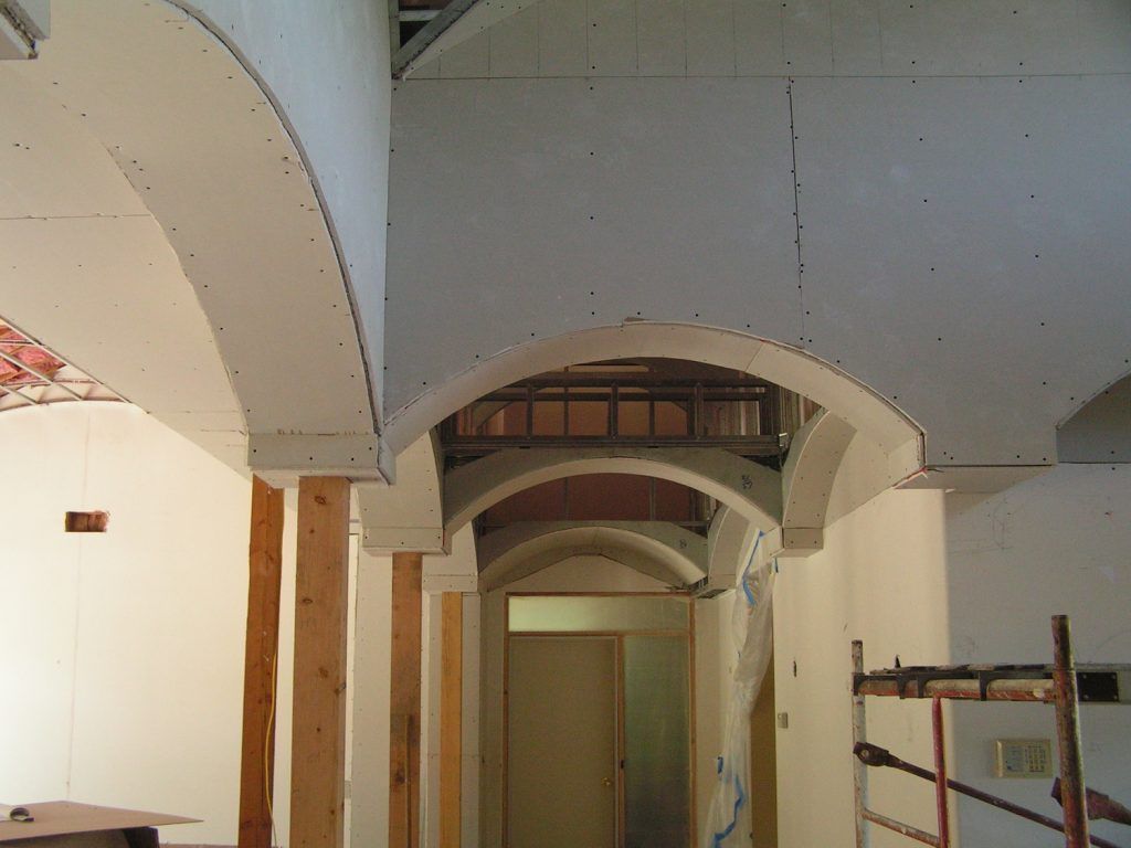 A hallway with a few arches in it