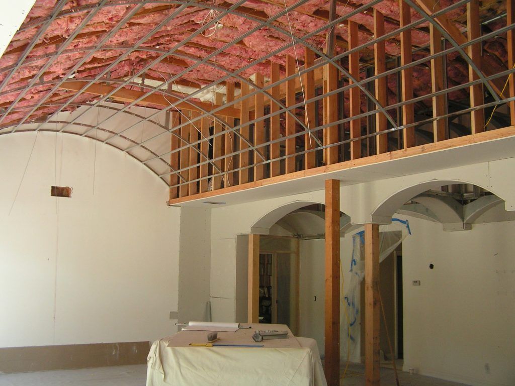 A room with arches and a ceiling that is being built