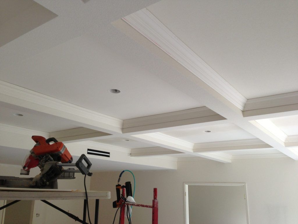 A circular saw is hanging from the ceiling of a room
