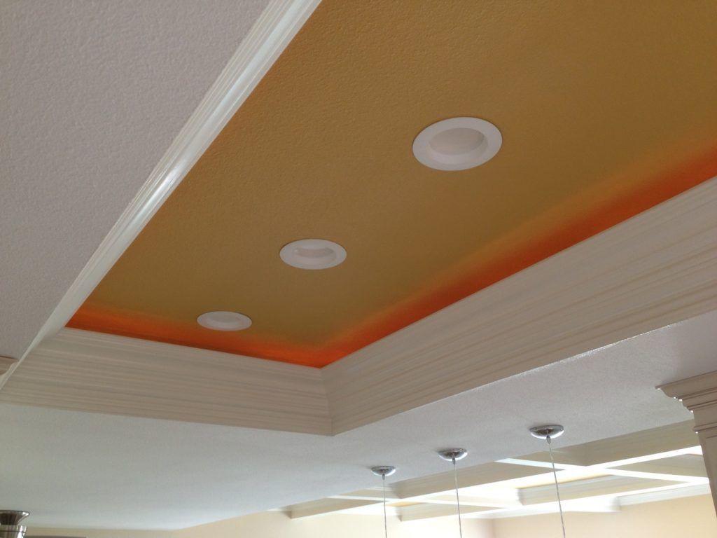A ceiling with three lights on it in a room