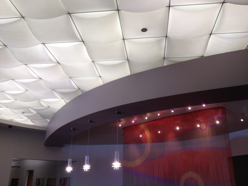 A room with a ceiling that has a lot of lights on it