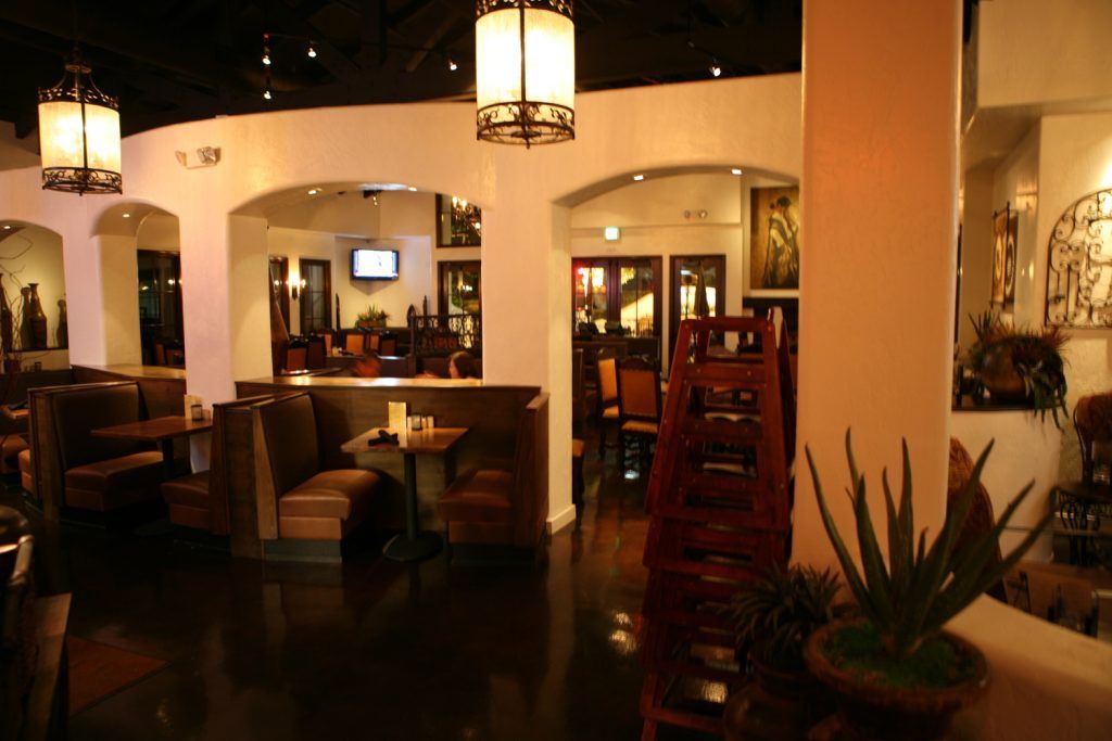 A restaurant with a lot of tables and chairs