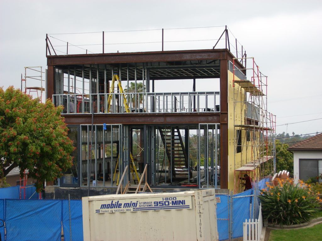 A building under construction with a sign