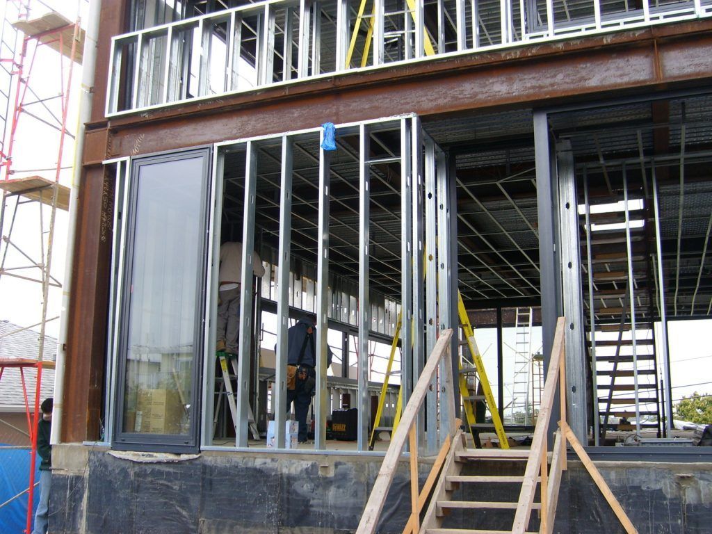 A building under construction with stairs leading up to it