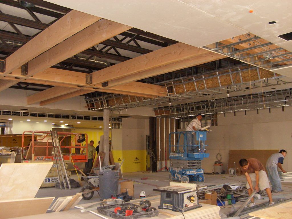 A group of construction workers are working on a building