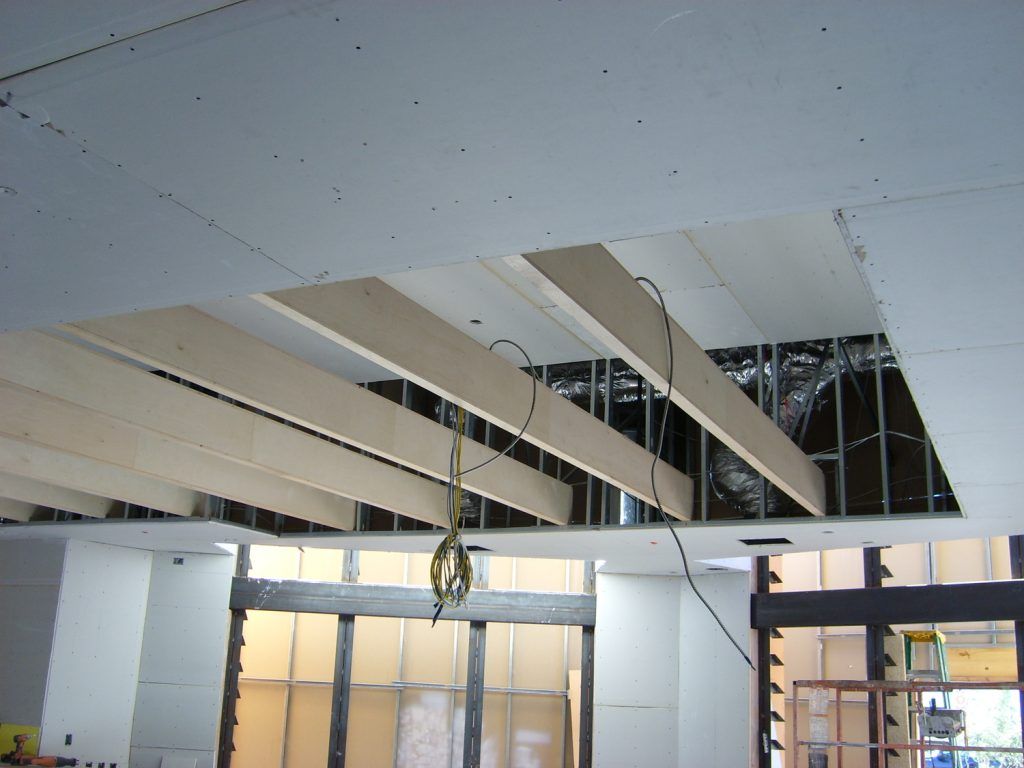 A room with a ceiling that has a hole in it
