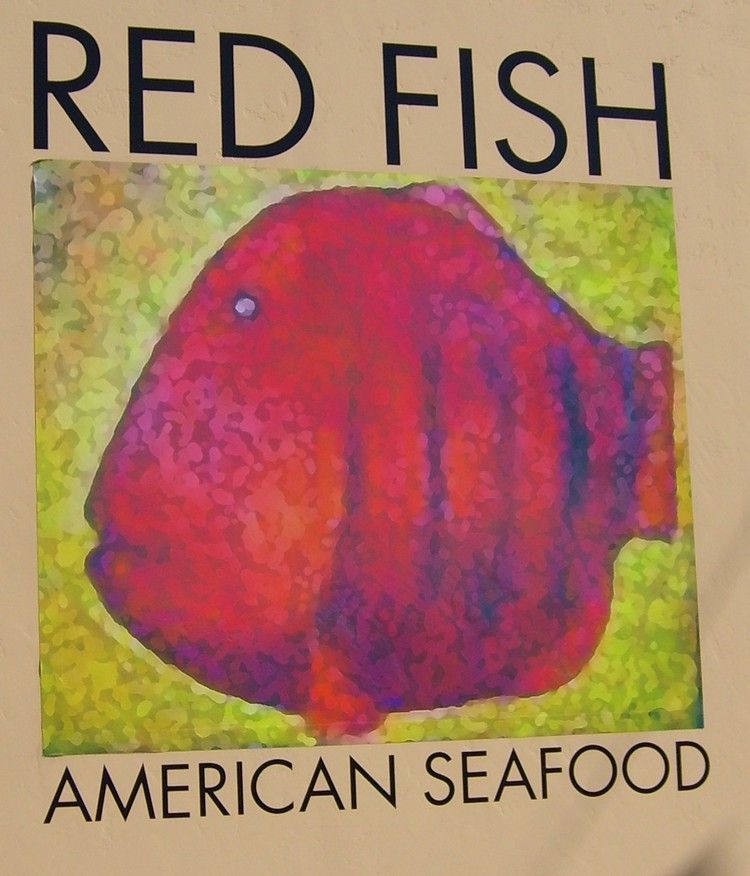A painting of a red fish with the words red fish american seafood below it