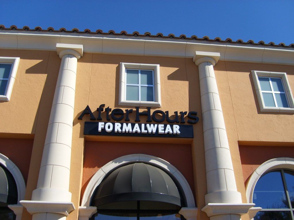 A building with a sign that says after hours formalwear