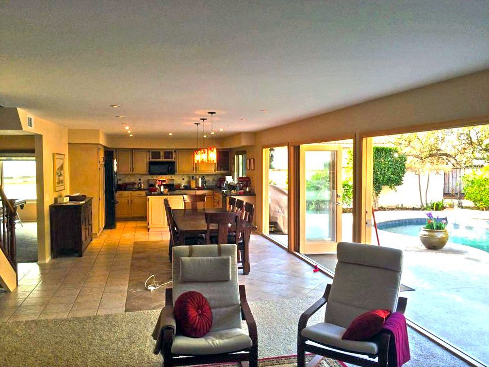 A living room with two chairs and a table