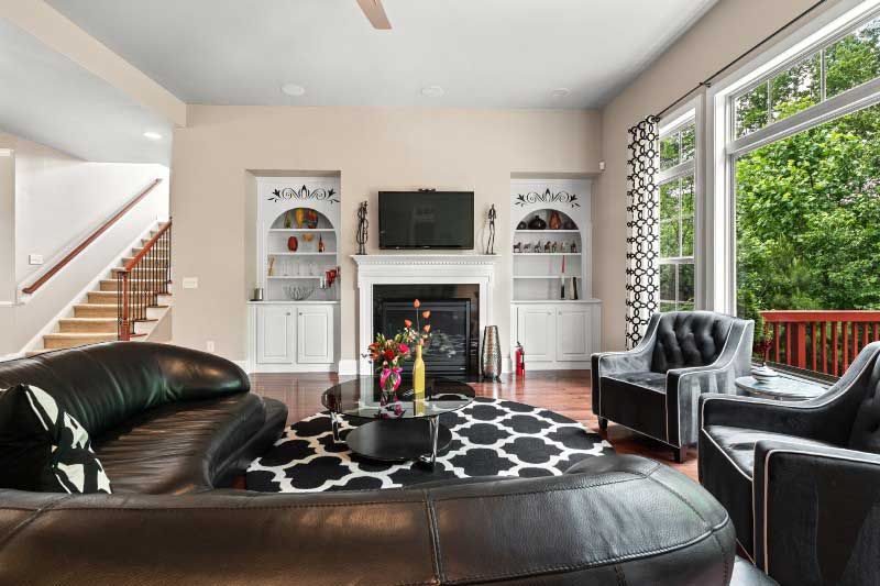 A living room filled with furniture and a fireplace.