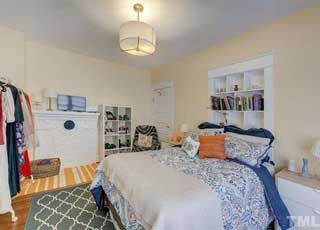 There is a bed in the middle of the room.