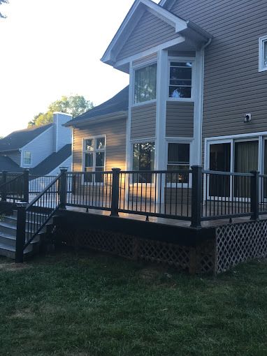 A large house with a large deck in front of it