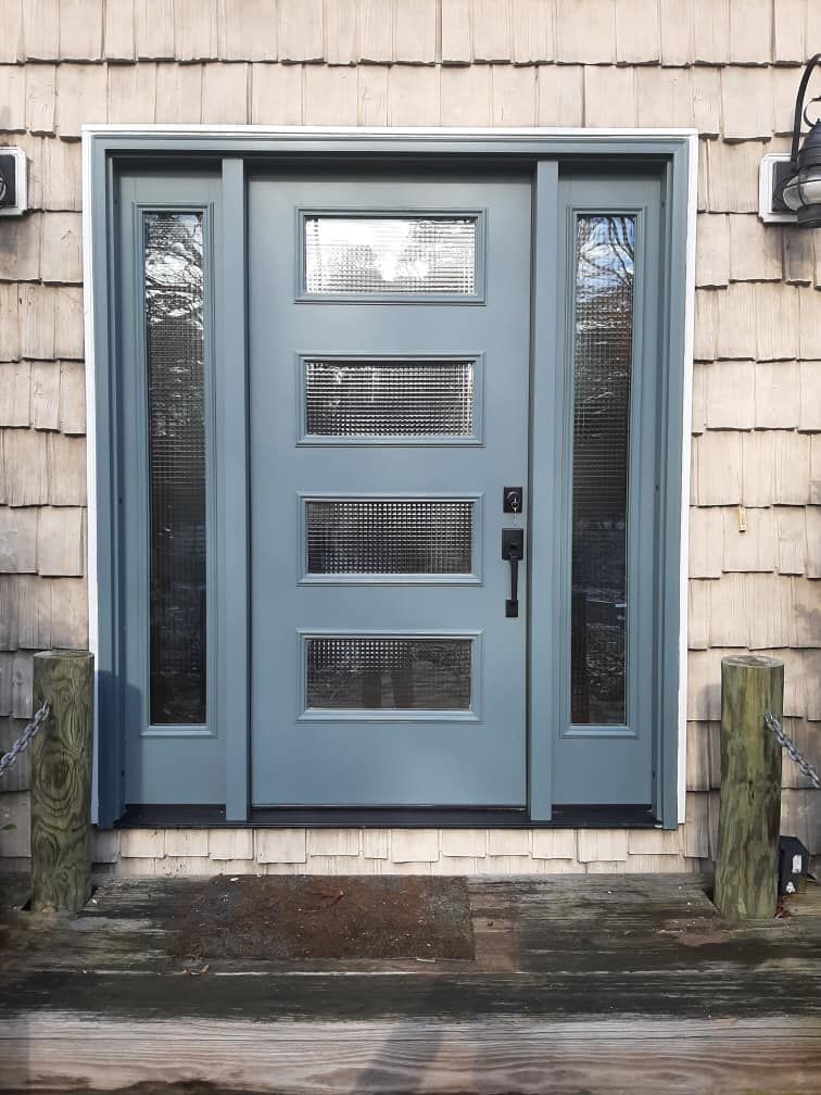 The front door of a house with a blue door