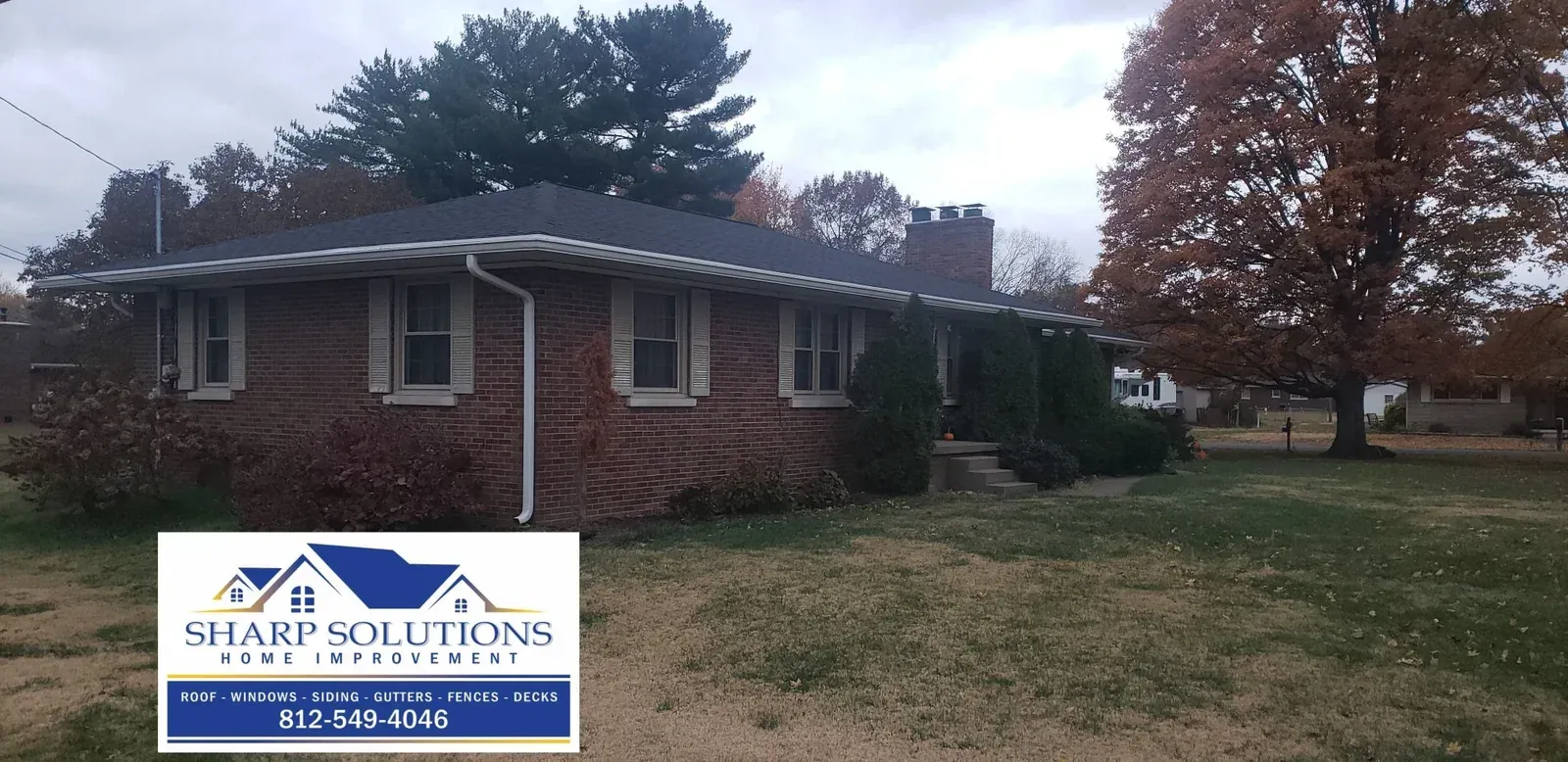 Brick single-story house with a white sign for Star Solutions in the front yard