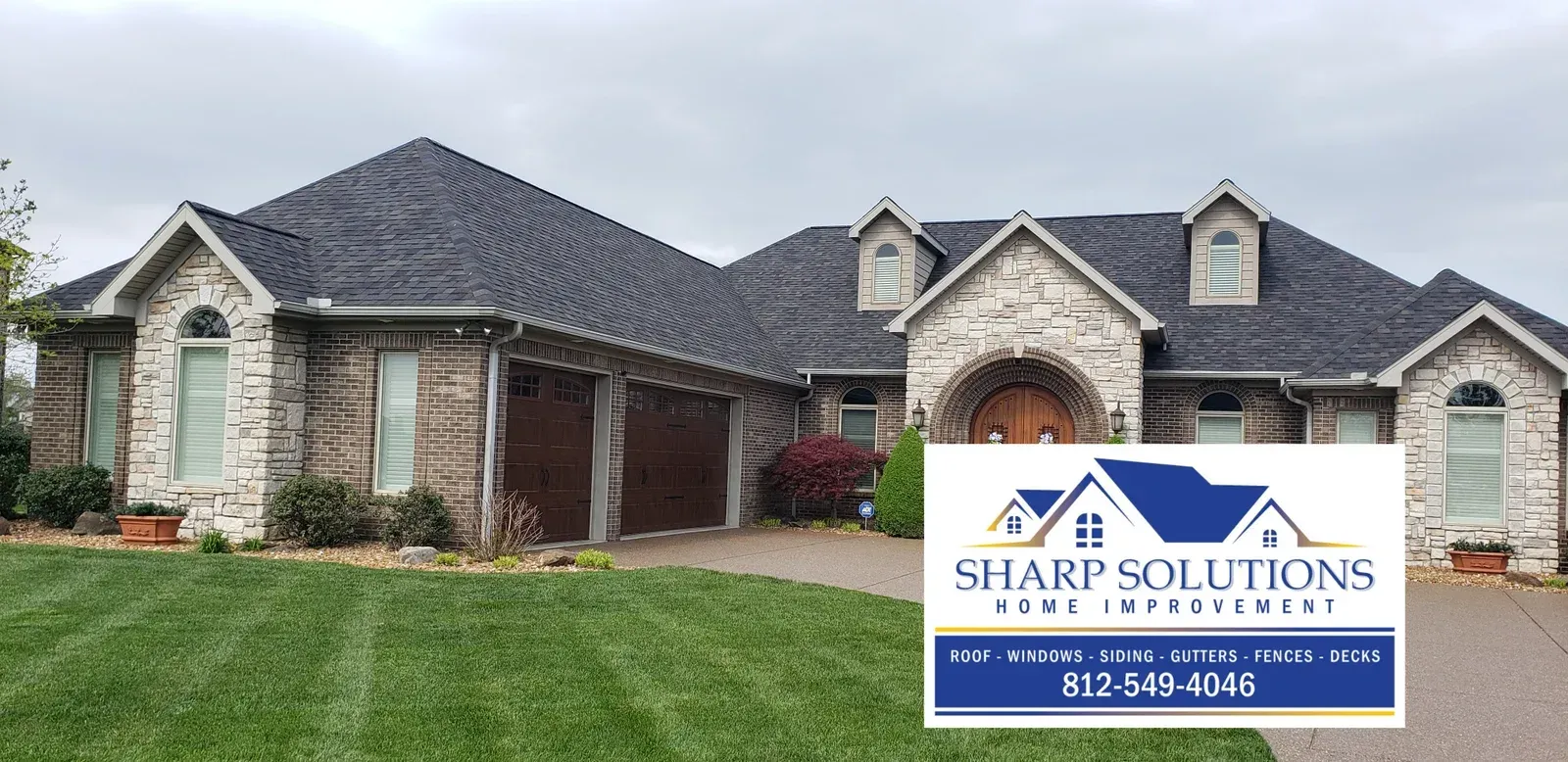 Brick suburban house with a Sharp Solutions real estate sign on the lawn