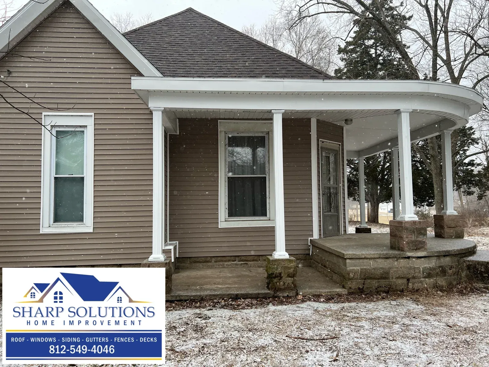 House exterior with a white porch, stone steps, and Shari Solutions sign in the lower left.