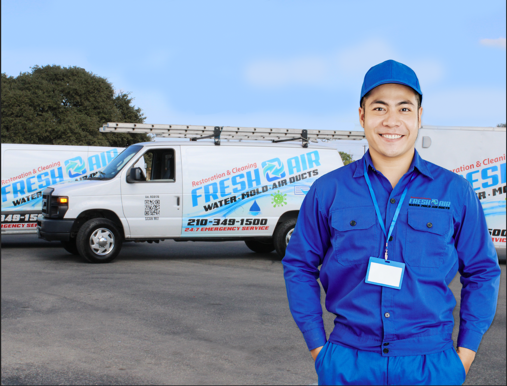 Smiling worker in blue uniform stands before a Fresh Air service van outdoors.