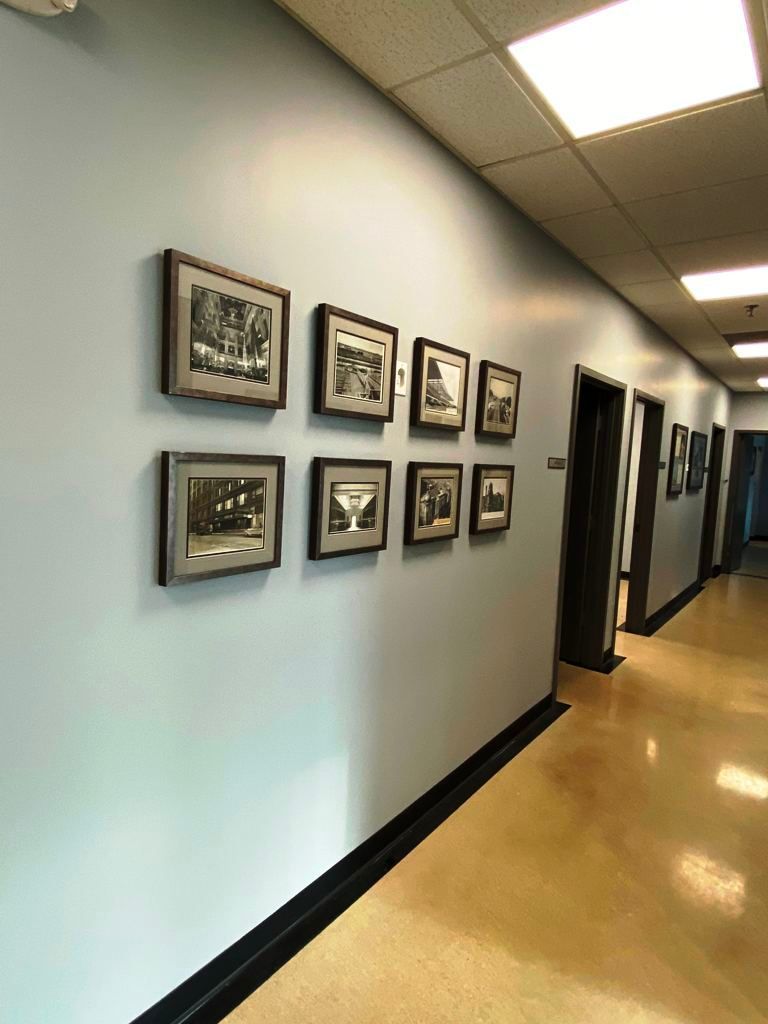 A hallway with a lot of pictures on the wall