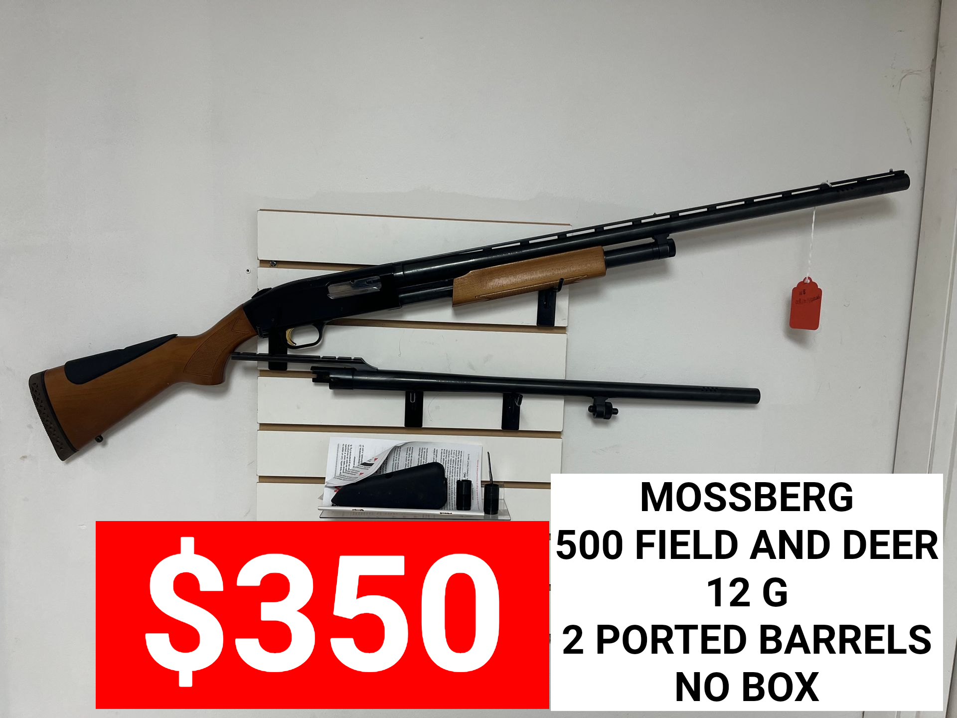 $350 sign for Mossberg .12 gauge field and deer 2-port barrel shotgun on wall mount