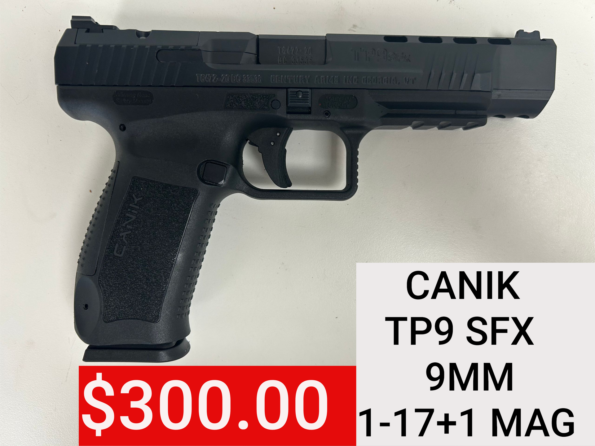 Black Canik TP9 SFX 9mm pistol on white background with