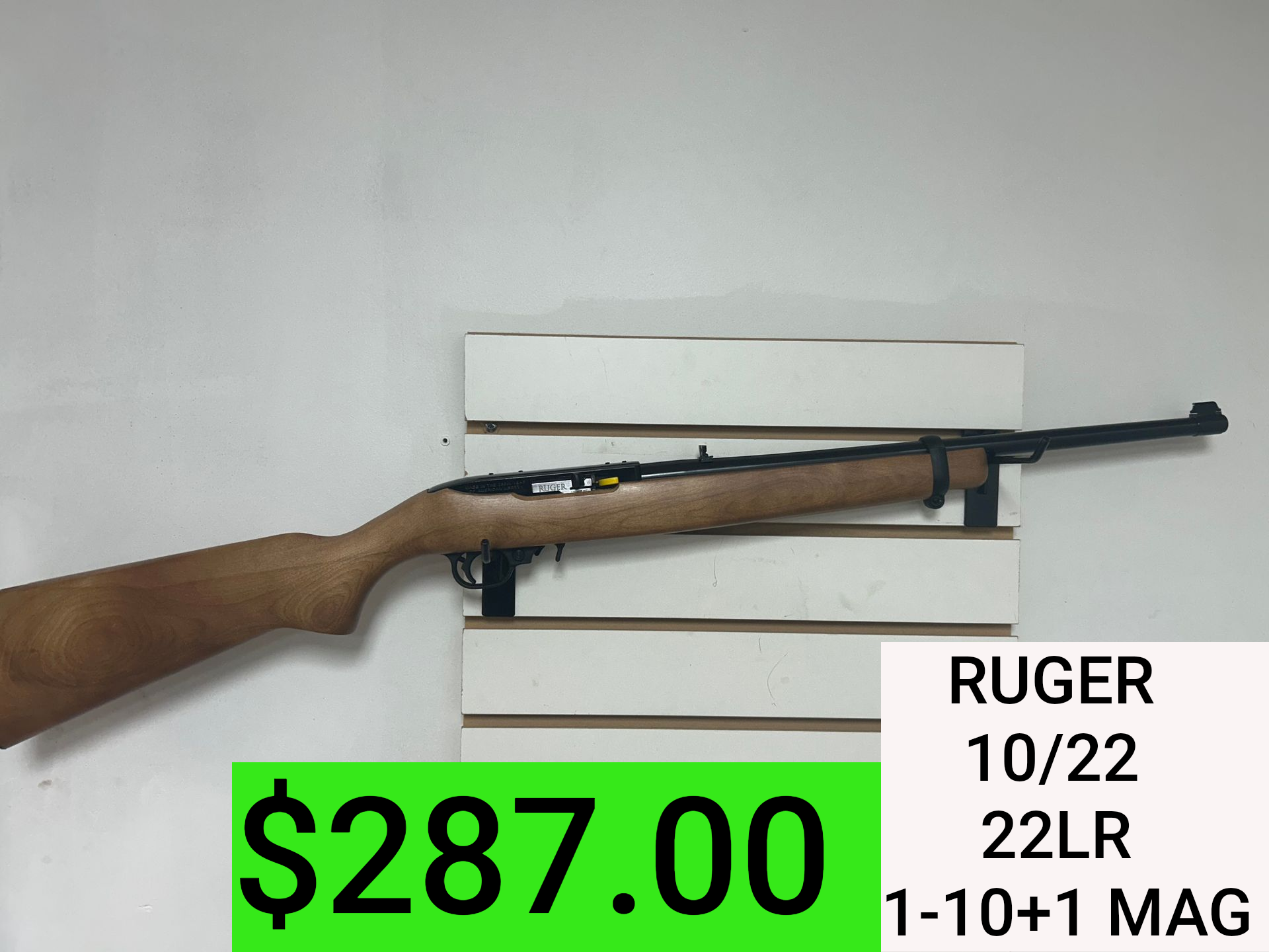 Ruger 10/22 .22LR rifle on display with price tag, green $287.00 label
