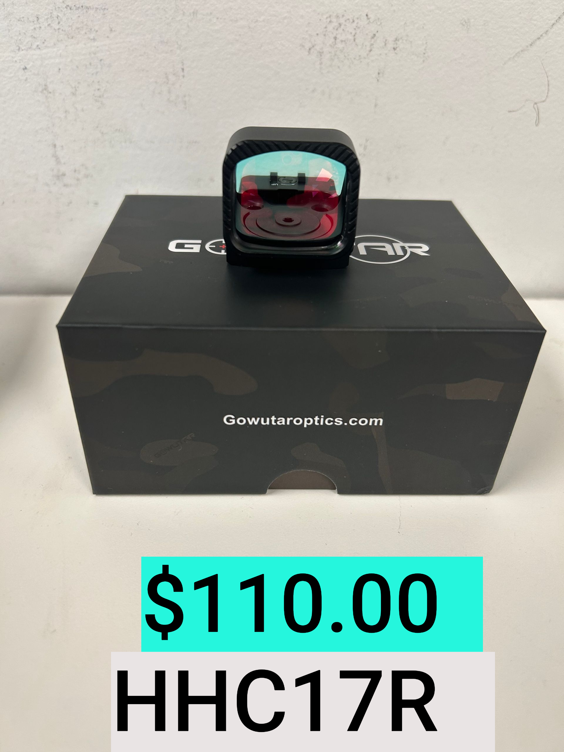 Small square smartwatch on a black box, with price tag $110.00 and code HHC17R below.