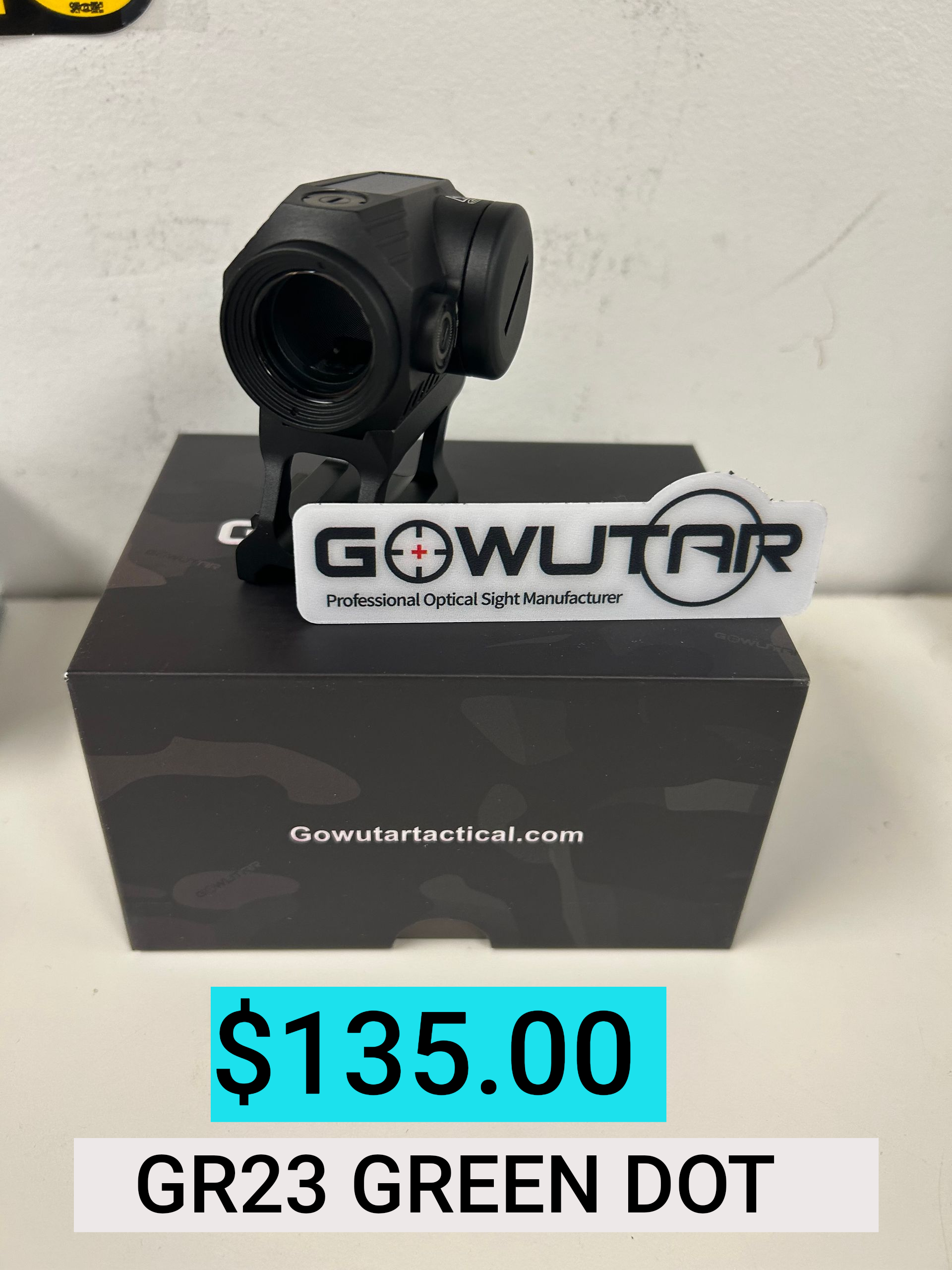 Black GOWUTAR green dot sight on box, labeled $135.00 and GR23 GREEN DOT