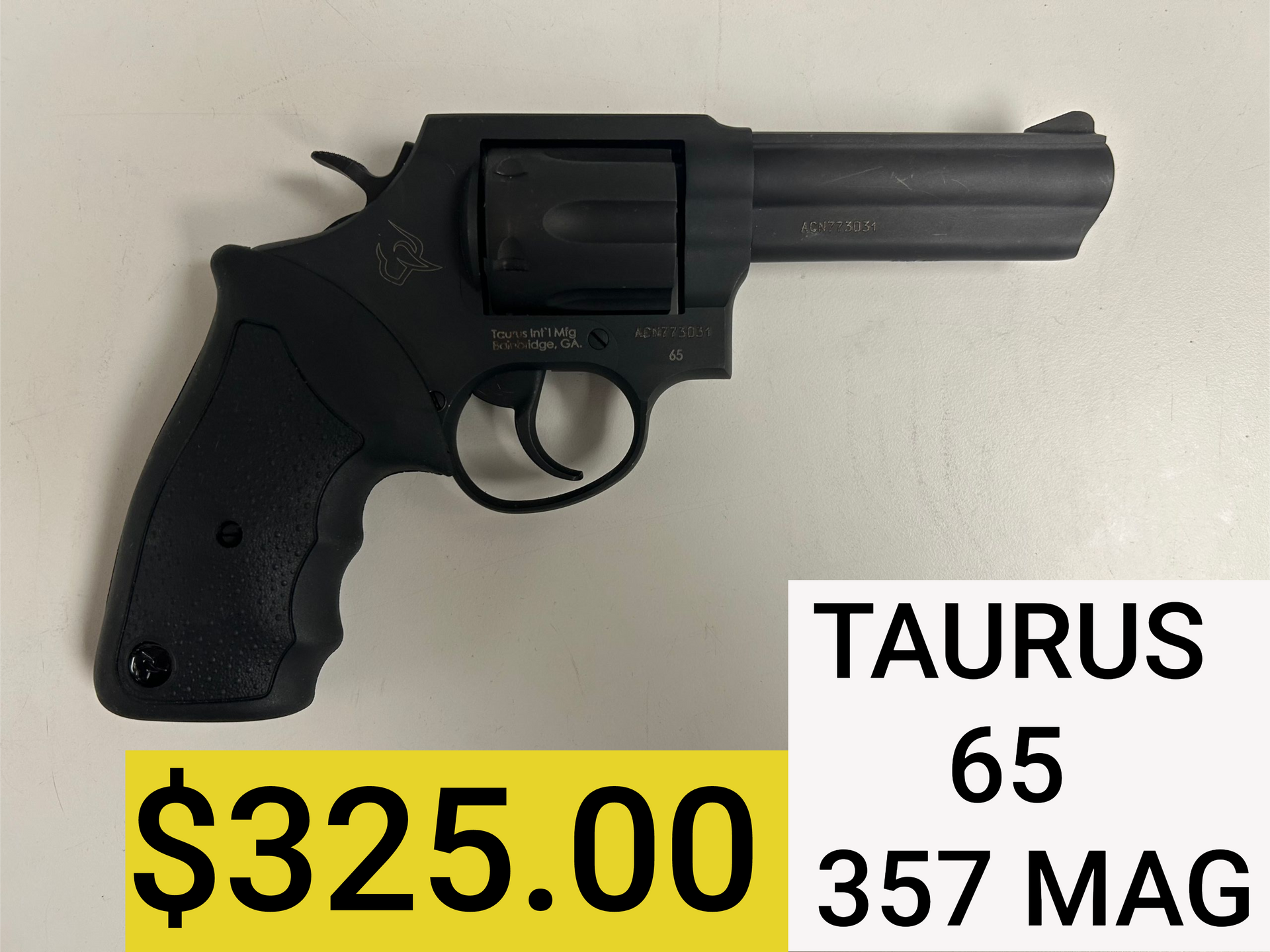 Black Taurus revolver, labeled “TAURUS 65 357 MAG,” priced at $325.
