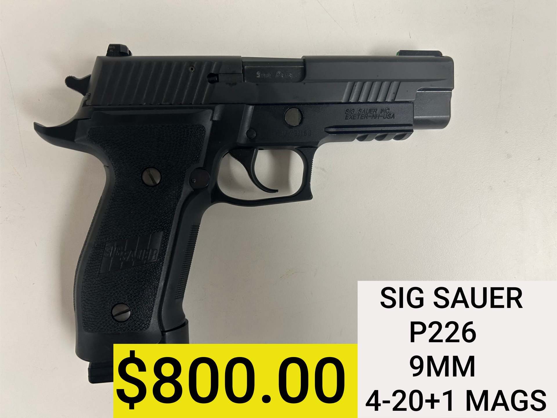 SIG Sauer P226 9mm pistol on a light background with $800 price tag and 4.20+1 mags.
