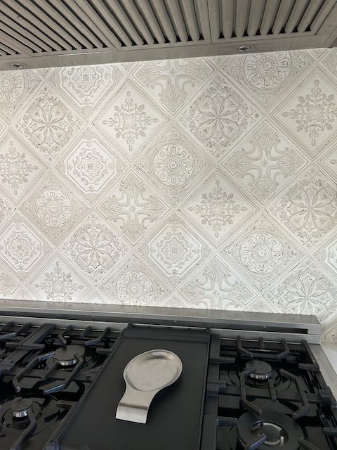 A stove top oven with a spoon rest on top of it