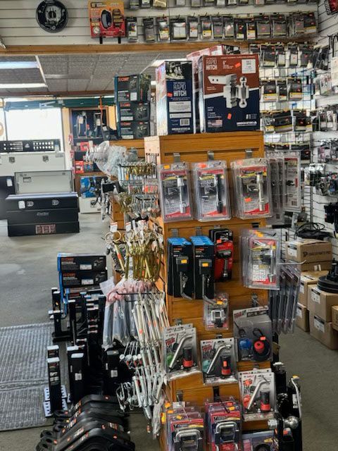 Shop aisle with shelves of tools, parts, and accessories