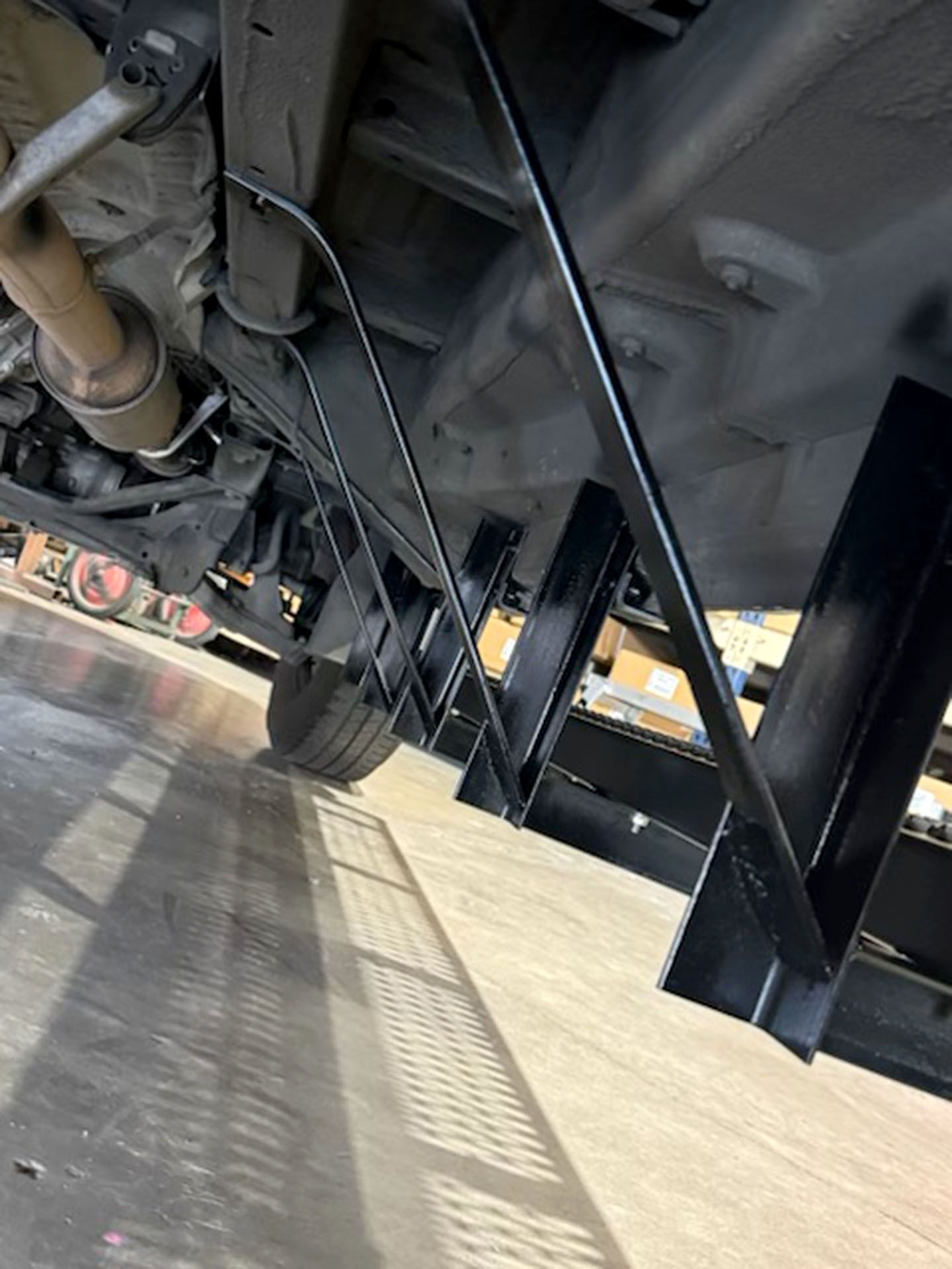 Underside of a truck trailer on a concrete lot