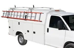 White utility truck with a ladder rack and red ladder on top, side view.