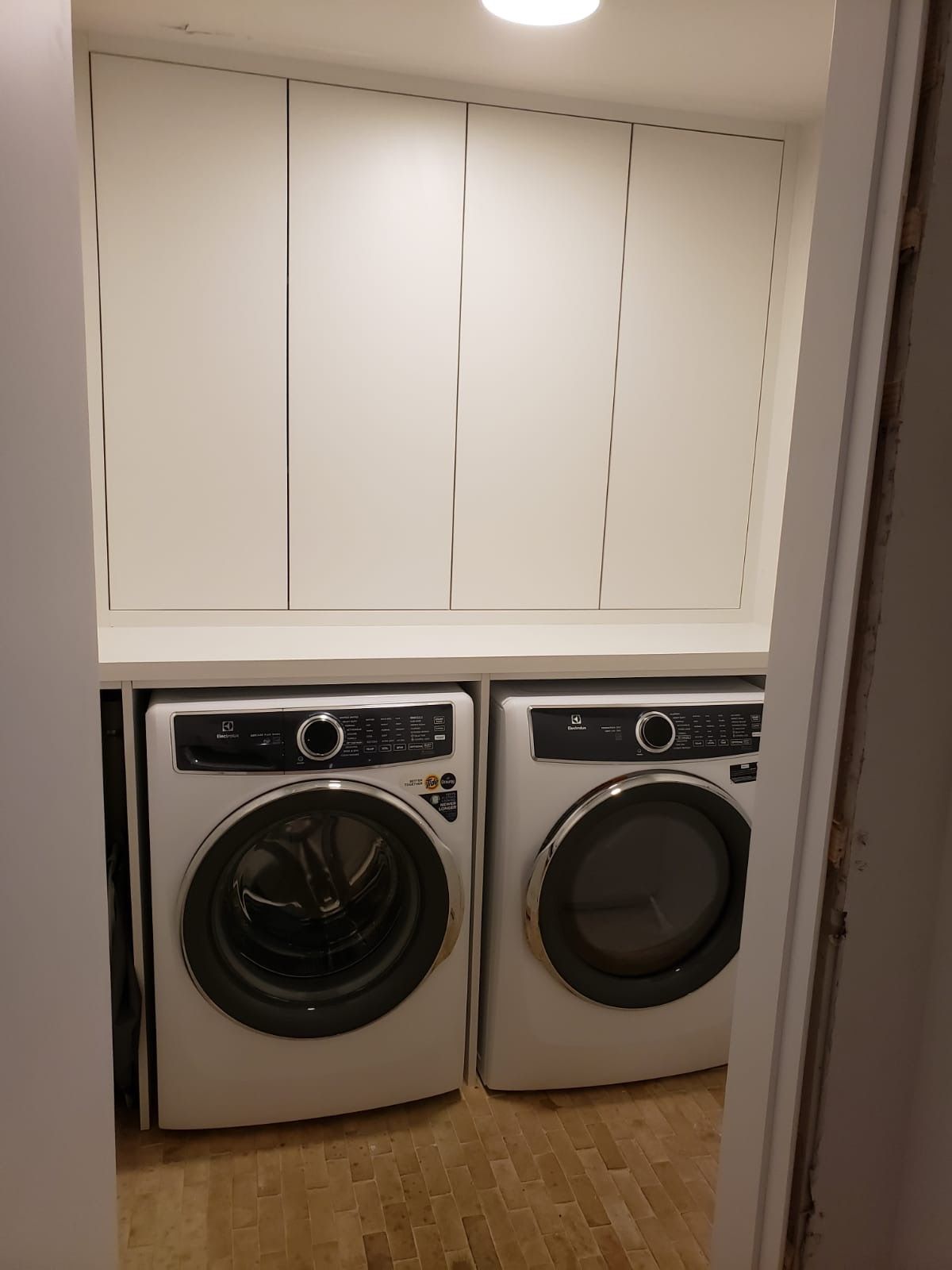 a closet with a washer and dryer