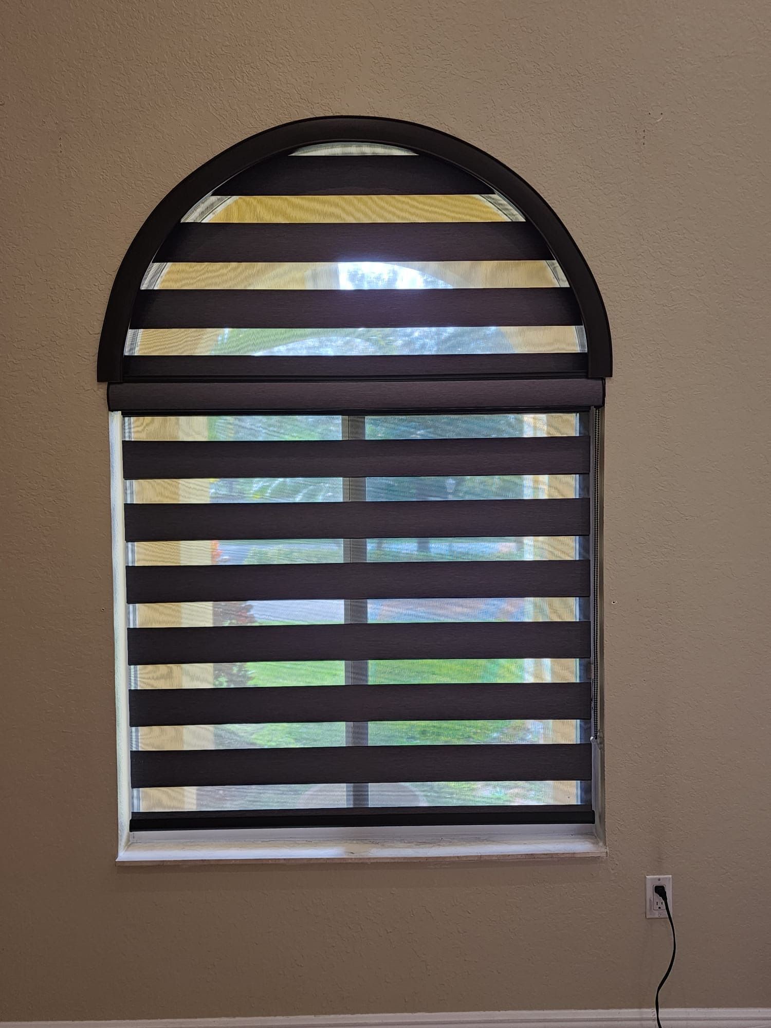 a window with striped blinds on it