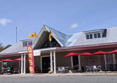 Restaurant with outdoor seating. Red umbrellas,