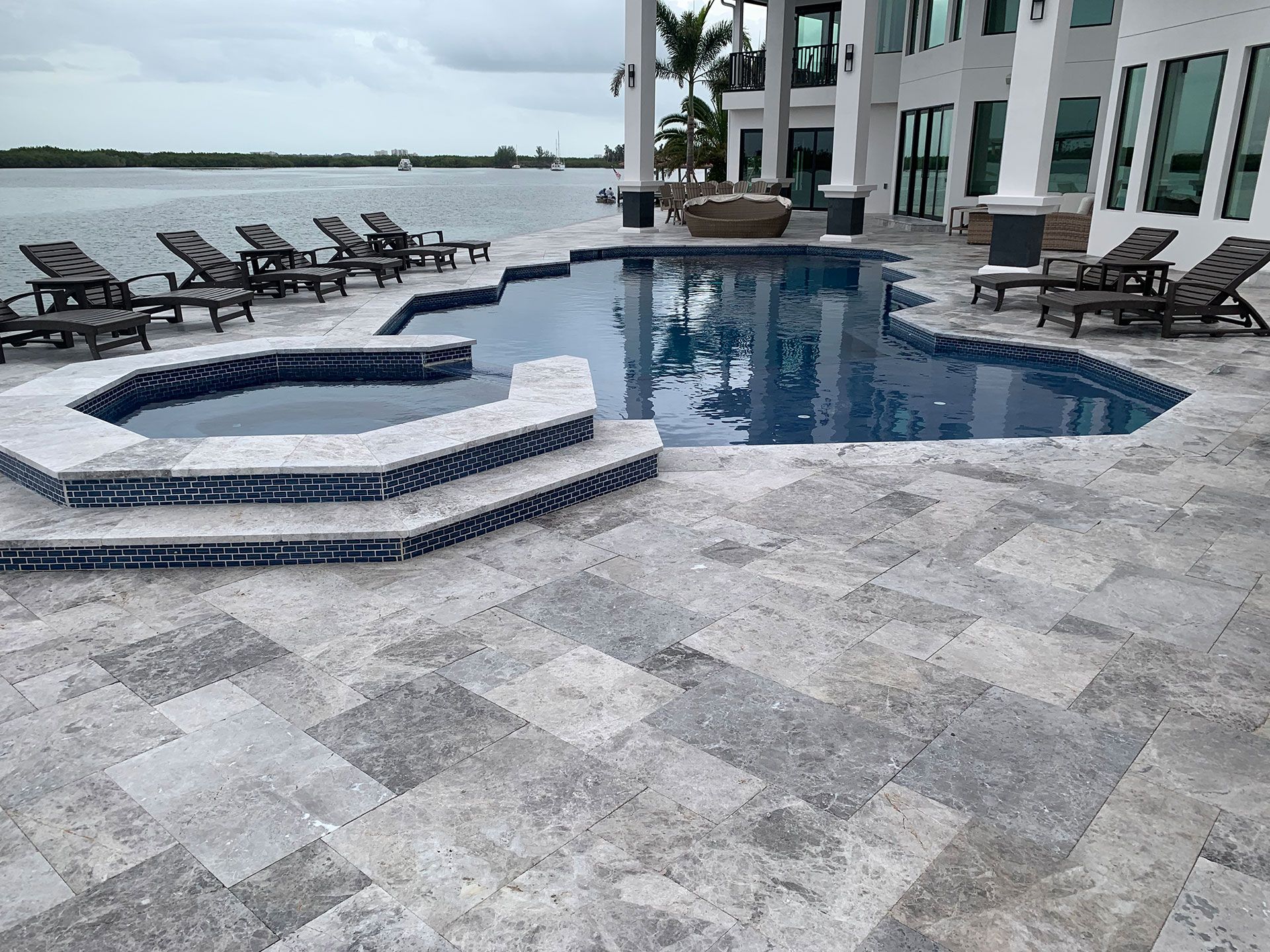 pool with jacuzzi by the sea